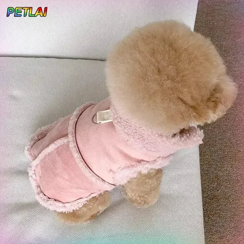 A fluffy, light pink cotton dog vest with a round, brown fur collar is displayed on a white surface.