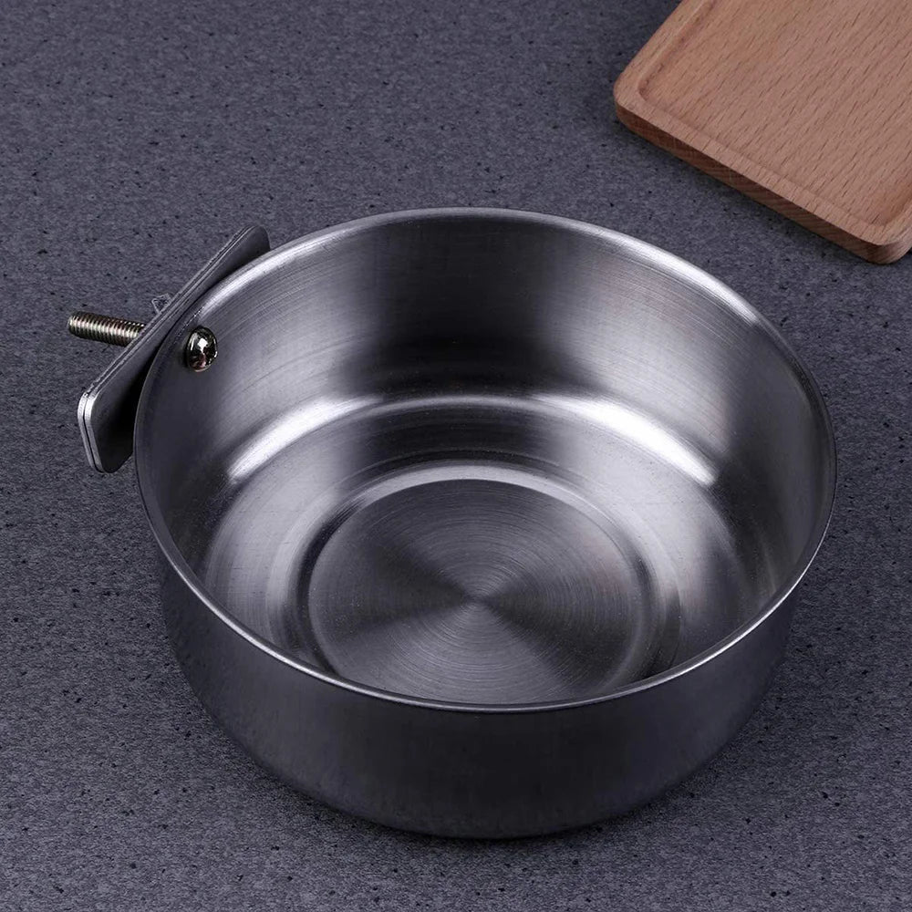 A stainless steel hanging bird bowl with a lid is shown on a dark gray surface.