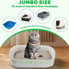 A fluffy gray cat is sitting inside a large white litter box liner, demonstrating the product's fit.