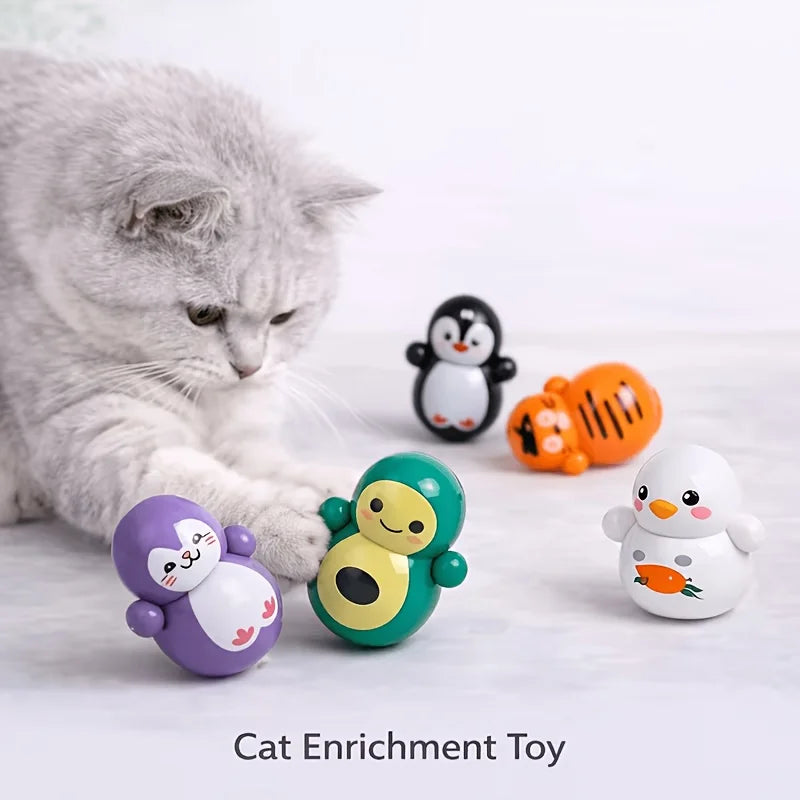 A set of ten self-rolling cat enrichment toys featuring various animal characters in purple, yellow, and white.
