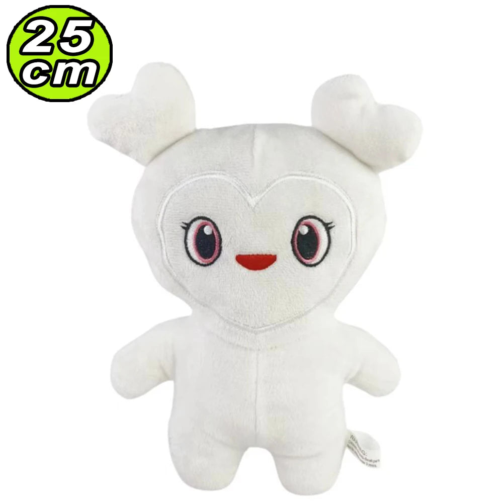 A white plush toy resembling a cute, round creature with large eyes and small ears.