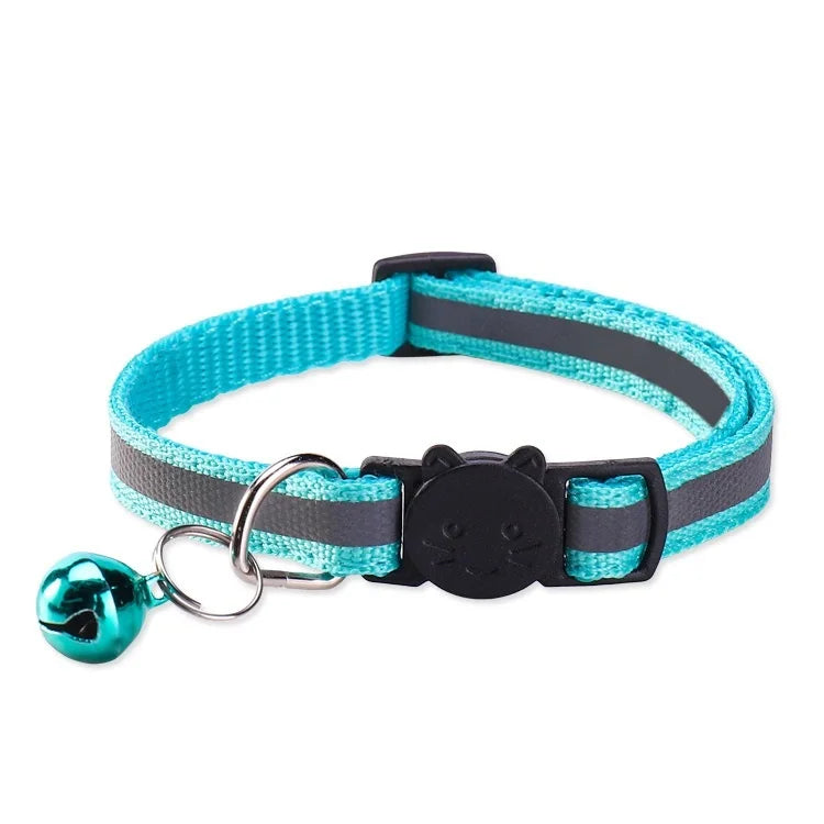 A turquoise and gray safety breakaway cat collar with a black bell attached.