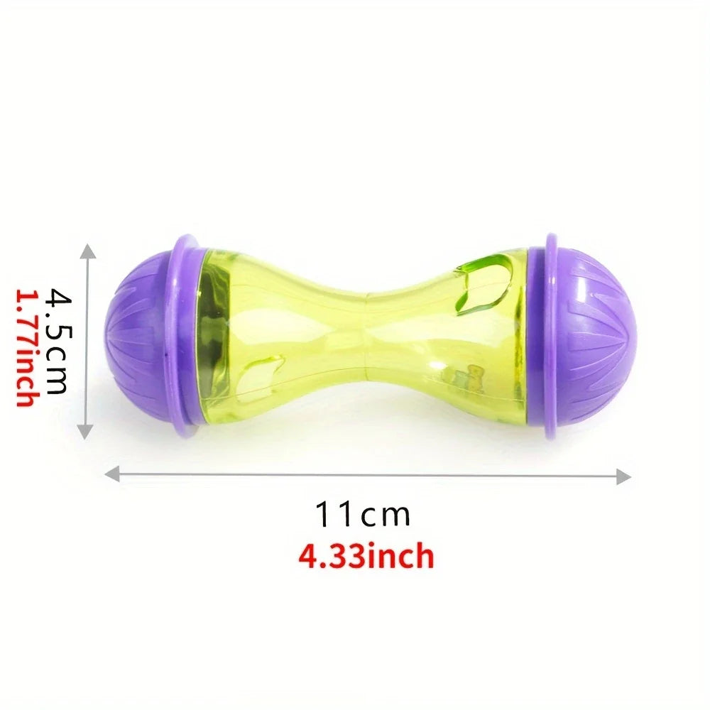 Juguete pelota para mascota interactivo amarillo y morado, mide 11 cm de largo y 4.5 cm de alto.