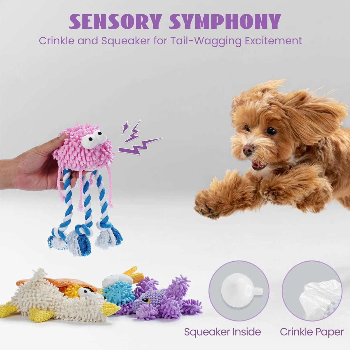 A hand holds a pink crinkle squeaker toy next to a fluffy dog, with various squakers and crinkle paper shown.