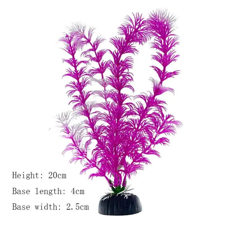 A vibrant magenta artificial aquarium plant with fine, feathery leaves and a dark base.