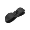 A black heavy-duty silicone cable organizer designed to manage household wires.