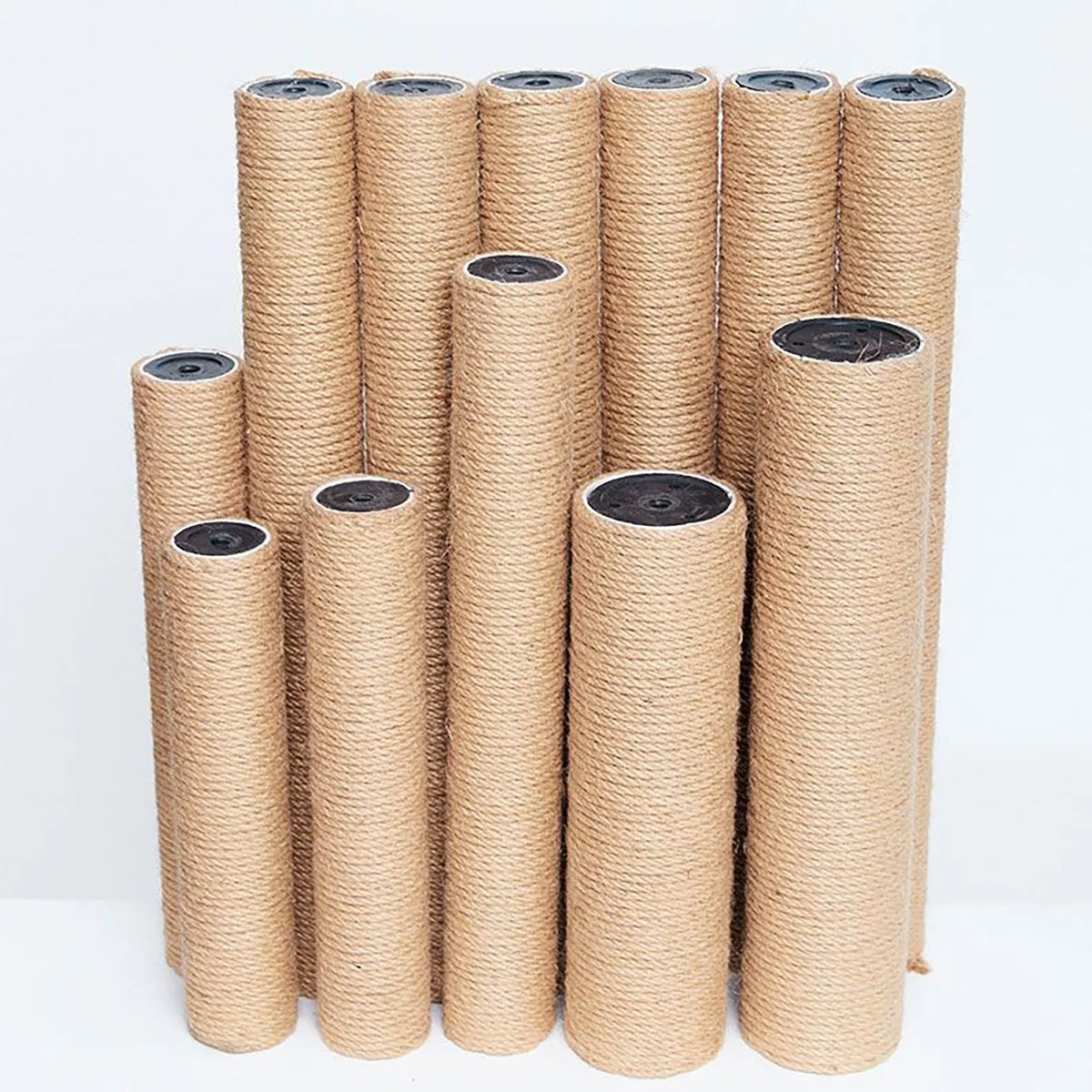 A collection of replacement sisal scratching posts for cat trees, cylindrical in light brown color.