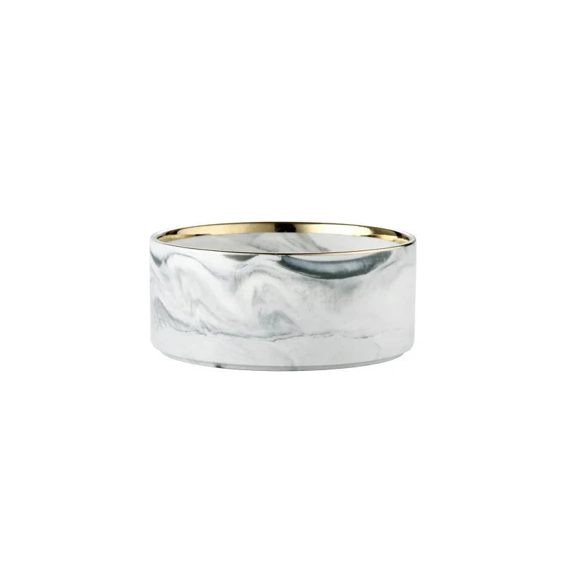 A set of double pet bowls made of marbled ceramic with a gold rim and a wooden stand.