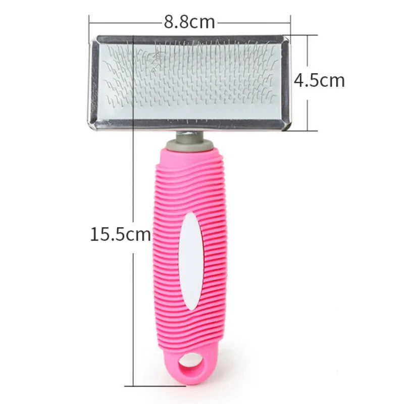 A pink silicone cat comb with stainless steel pins for gentle pet grooming.