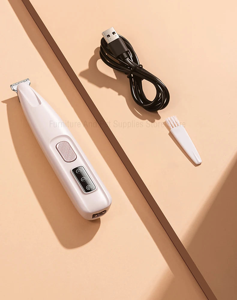 A white waterproof pet grooming trimmer and its black charging cable are shown on a beige surface.