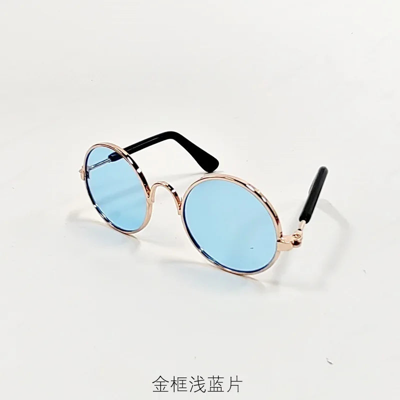 Goldvergoldete runde Sonnenbrille mit schwarzen Rahmen für Haustiere