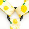 A yellow and white lemon print dog collar with soft neoprene padding.