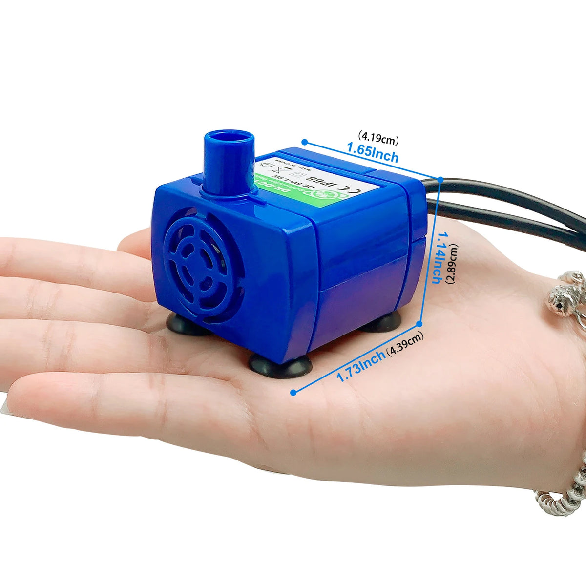 A blue silent replacement water pump device is shown resting on a person's palm.