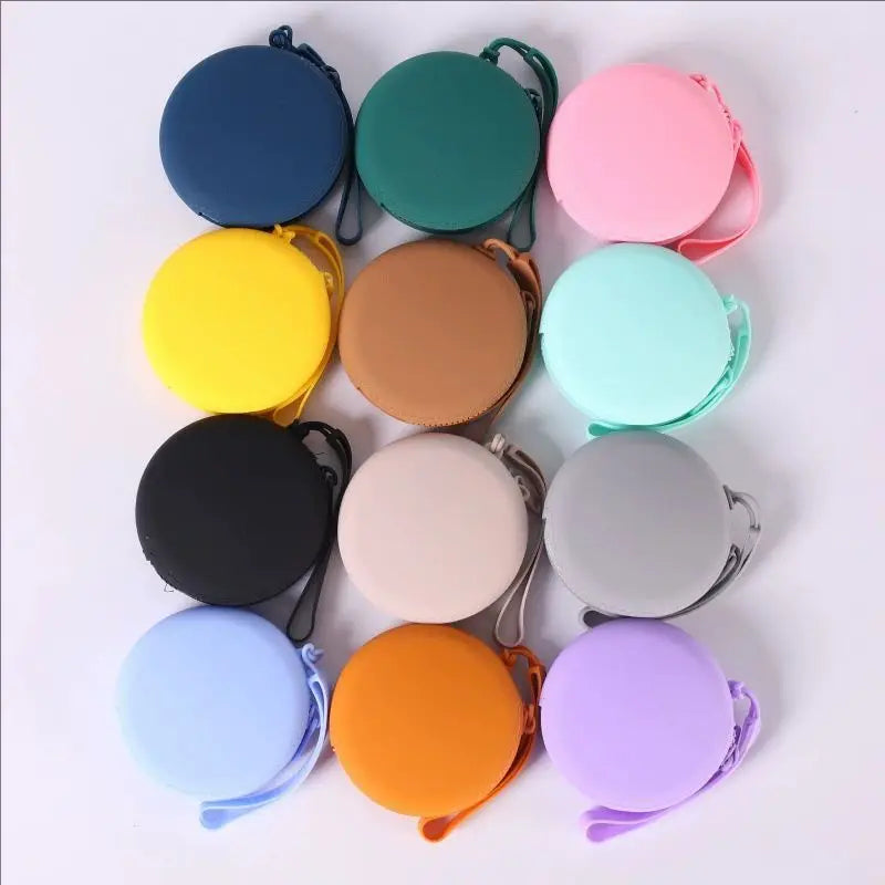 A collection of colorful silicone pet treat pouches in various shades including blue, green, yellow, pink, and purple.