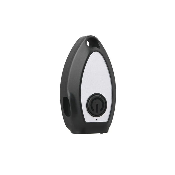 A black and white handheld ultrasonic dog bark deterrent device with a round button.