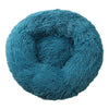 A round, teal blue plush pet bed for dogs and cats with a fluffy texture.