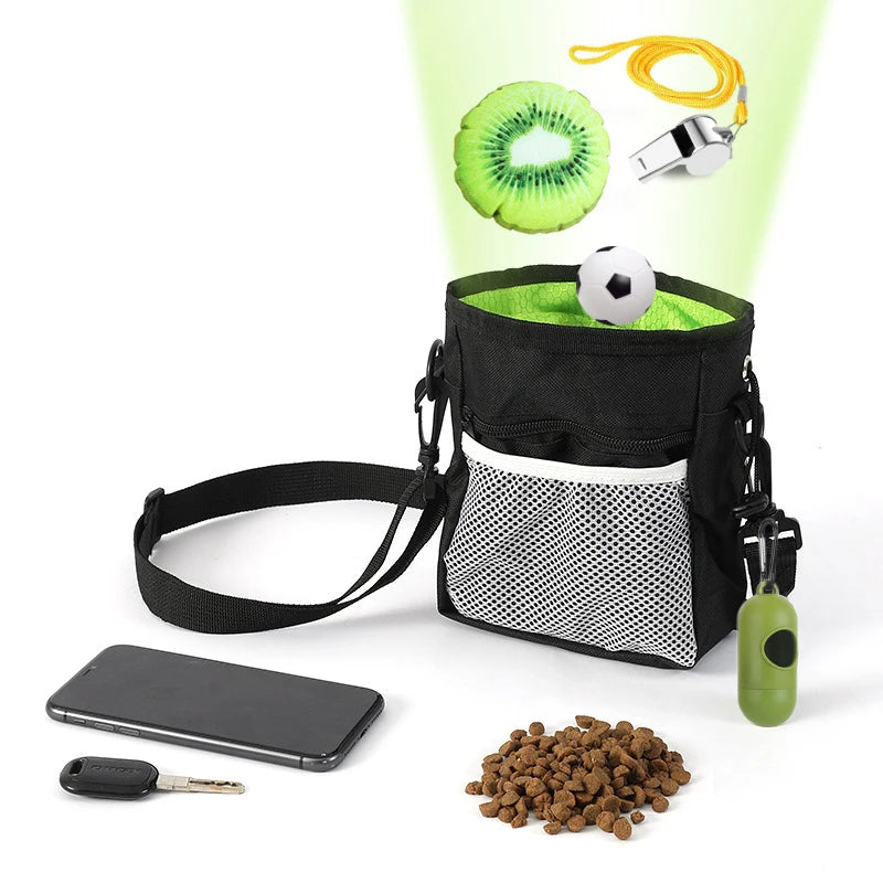 A black pet training treat bag filled with green treats, a black smartphone, and a small key are shown.
