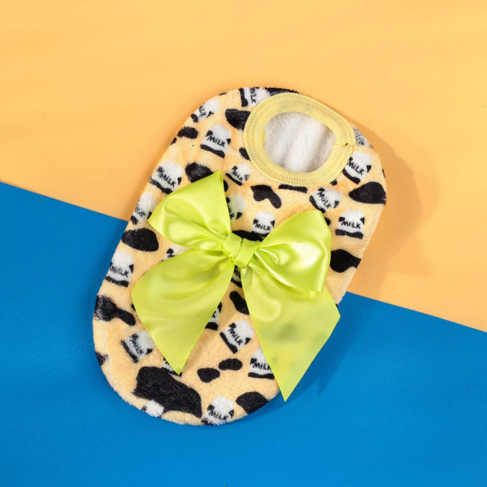 A yellow and black leopard print knit pet sweater for small dogs and cats, displayed on a light orange background.