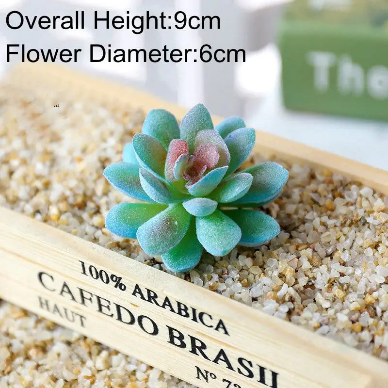 Blue artificial succulent plant with a flower diameter of 6cm resting on a wooden surface.