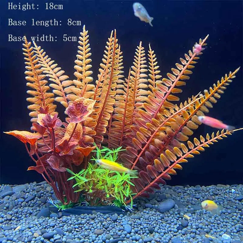 A realistic artificial aquarium plant featuring reddish-brown and orange fronds growing in a gravel substrate.