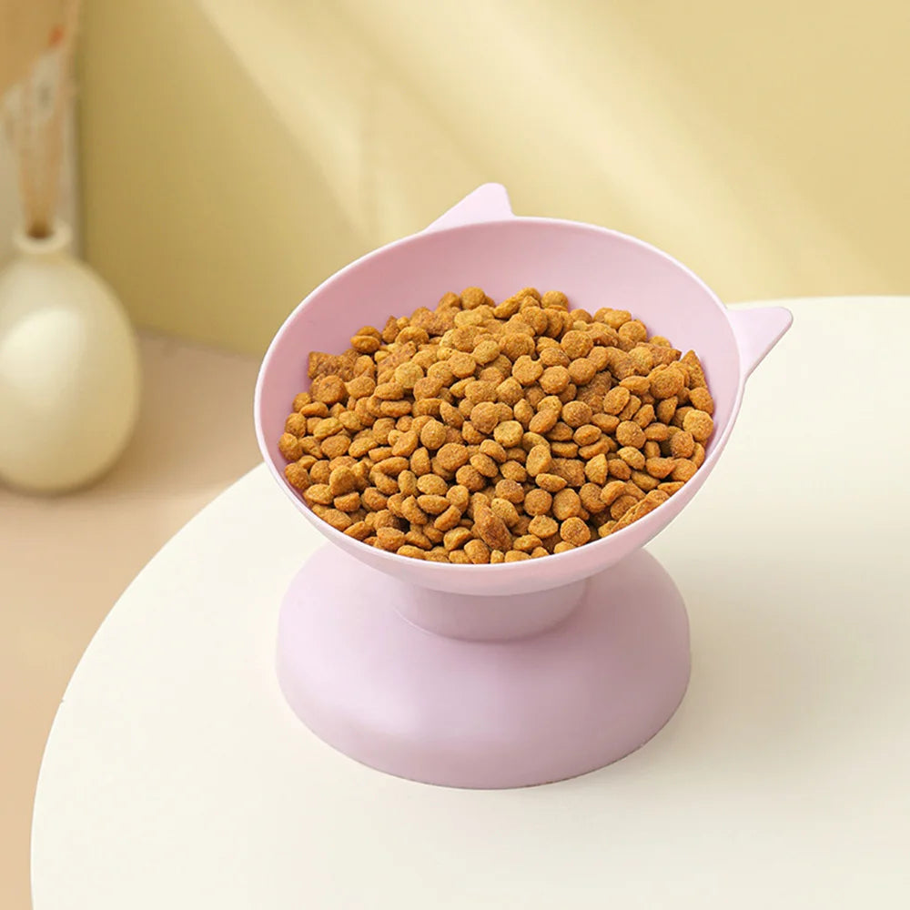A pink macaron elevated anti-spill pet food and water bowl with a non-slip base for cats and dogs.