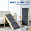 A portable wooden pet stairs and dog ramp product shown next to a sofa.
