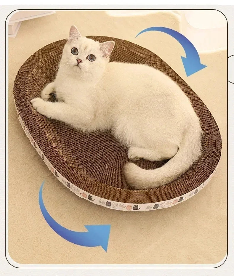 A fluffy white kitten is relaxing inside a brown corrugated cat scratcher pad.