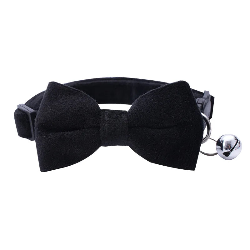 Black adjustable breakaway cat collar featuring a bow tie and a silver bell.