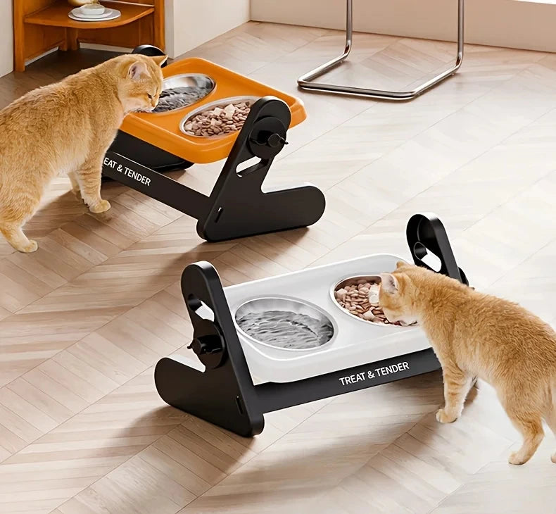 A ginger cat is interacting with an adjustable raised bowl for treats and tender, placed on a light wooden floor.