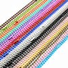 A close-up of a multicolored ball necklace set featuring gold and silver plated beads.