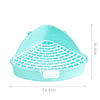 A light blue plastic corner litter box with a removable grate for small pets.