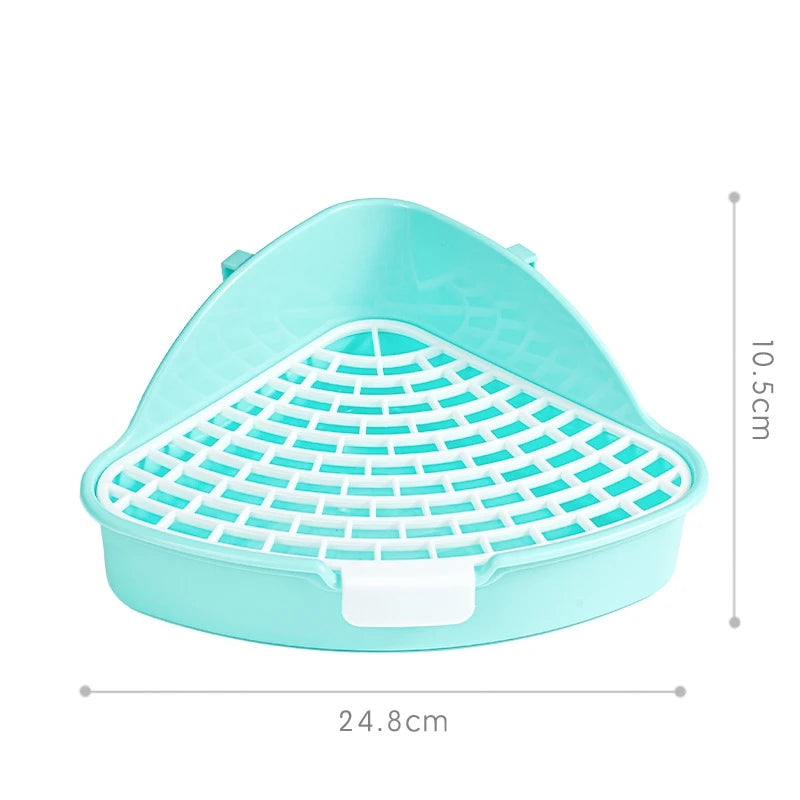 A light blue plastic corner litter box with a removable grate for small pets.
