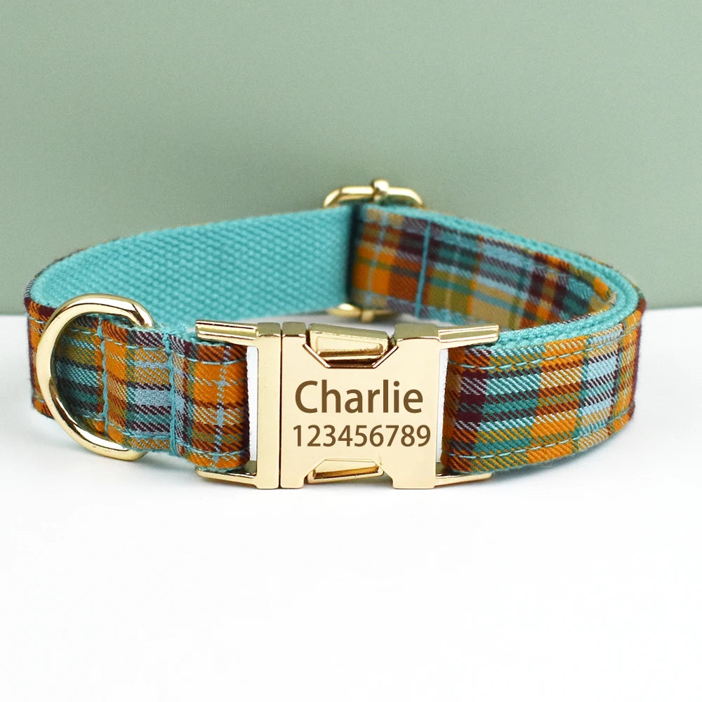 A personalized plaid dog collar in teal and orange fabric with a gold buckle and a metal plate engraved with the name Charlie