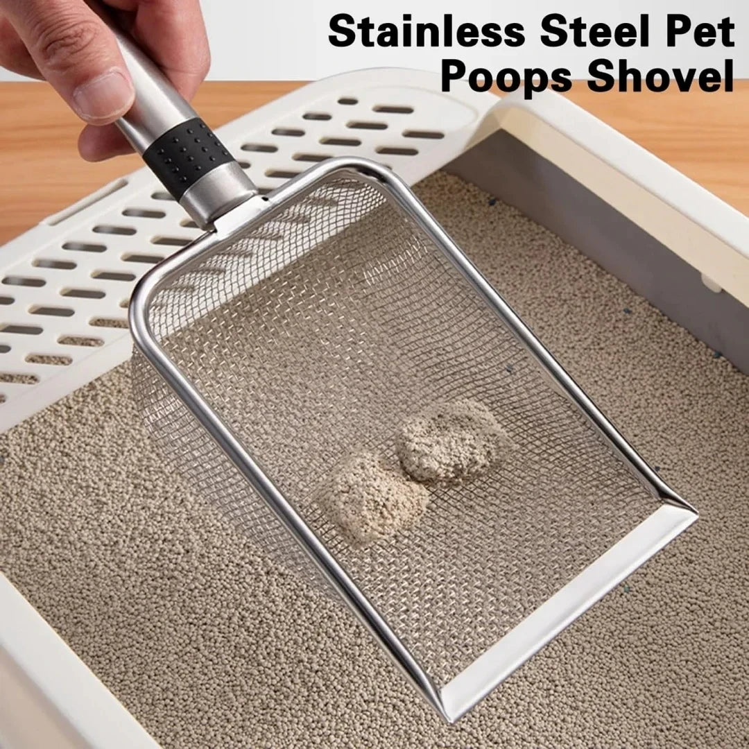 A hand is using a stainless steel pet poops shovel to scoop cat litter from a white plastic tray.