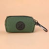 A dark olive green zippered pouch with a black cross emblem and a metal clip.