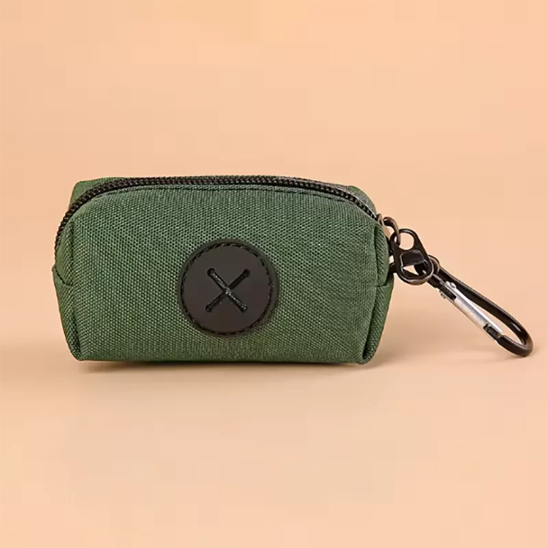 A dark olive green zippered pouch with a black cross emblem and a metal clip.