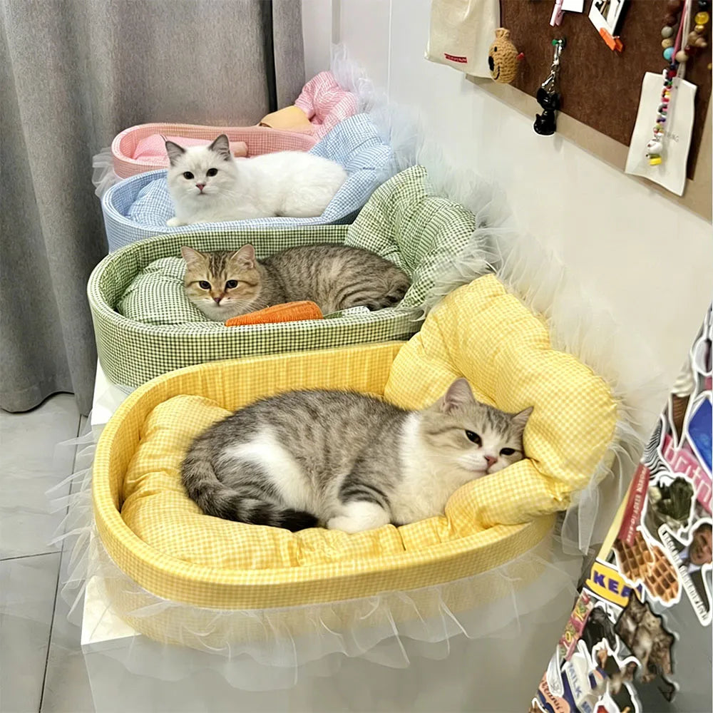 A collection of fluffy cats resting in various colorful, lace-trimmed plush pet sofa beds.