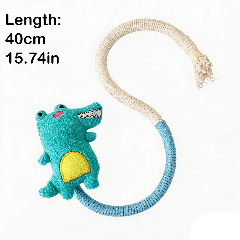 A turquoise and yellow stuffed dinosaur toy attached to a long, light-colored cotton rope.