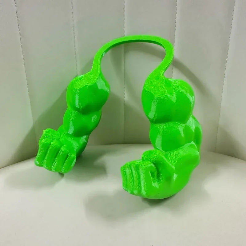 A bright green 3D printed accessory shaped like a cat muscle arm.