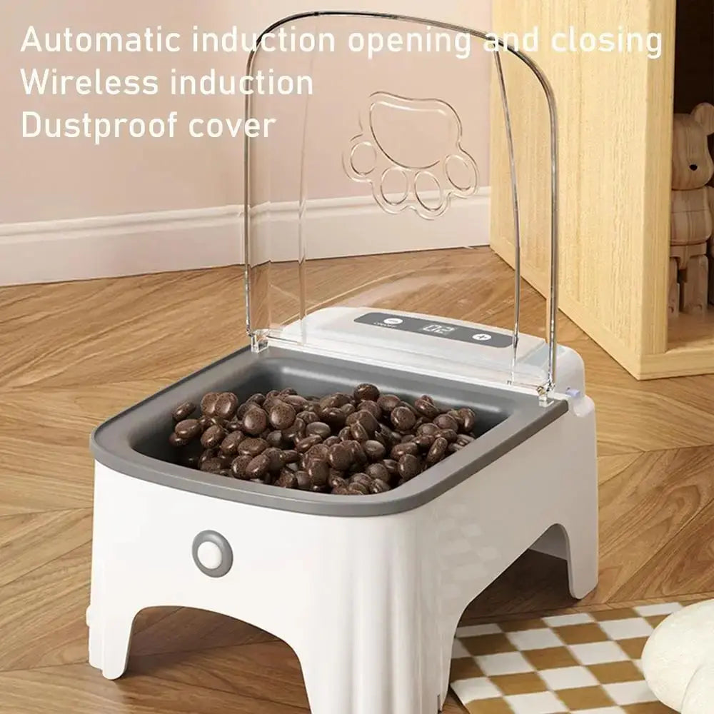 A white pet feeder with a clear induction cover is shown on a wooden floor.