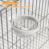 A grey large starry sky cup bird feeder with a transparent window hanging in a wire cage.