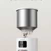 A silver anti-clog design new upgrade grinder is shown above a white pet feeder bowl.