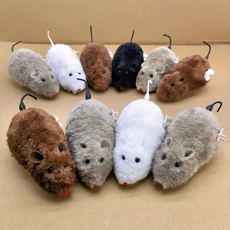A collection of wind-up plush mouse toys in various shades of brown, gray, and white.