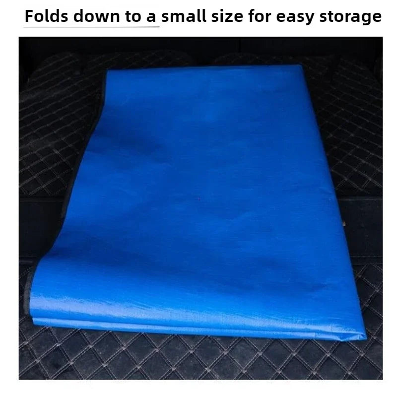 A bright blue waterproof car trunk mat folded down for easy storage.