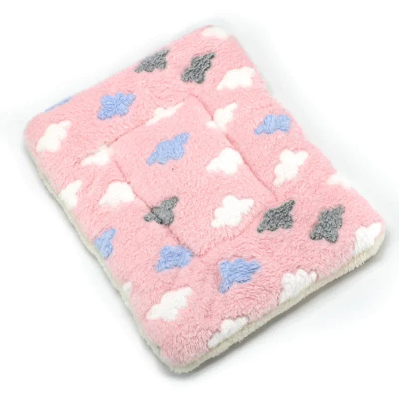 Pink plush fleece pet blanket with scattered gray and blue cloud shapes for dogs and cats