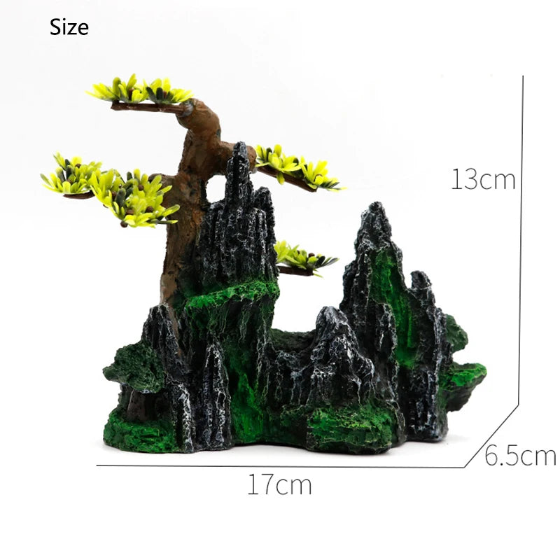 Resin aquarium rockery featuring a tree and cave formations with yellow foliage.