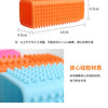 Orange silicone brush with silicone bristles used for pet hair removal
