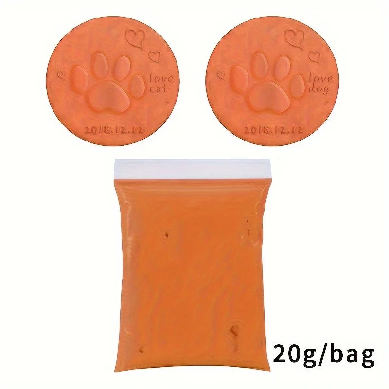 Orange clay product packaging showing two round ornaments with paw prints and a bag labeled 20g/bag