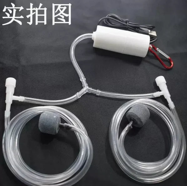 A clear tubing system with a white pump and two silicone aerators for an aquarium oxygen setup.
