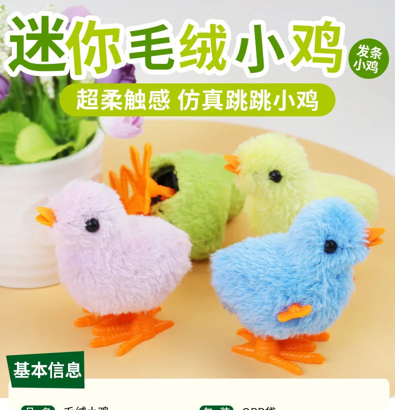 A set of three fluffy wind-up plush toys shaped like chicks in pink, green, and blue.